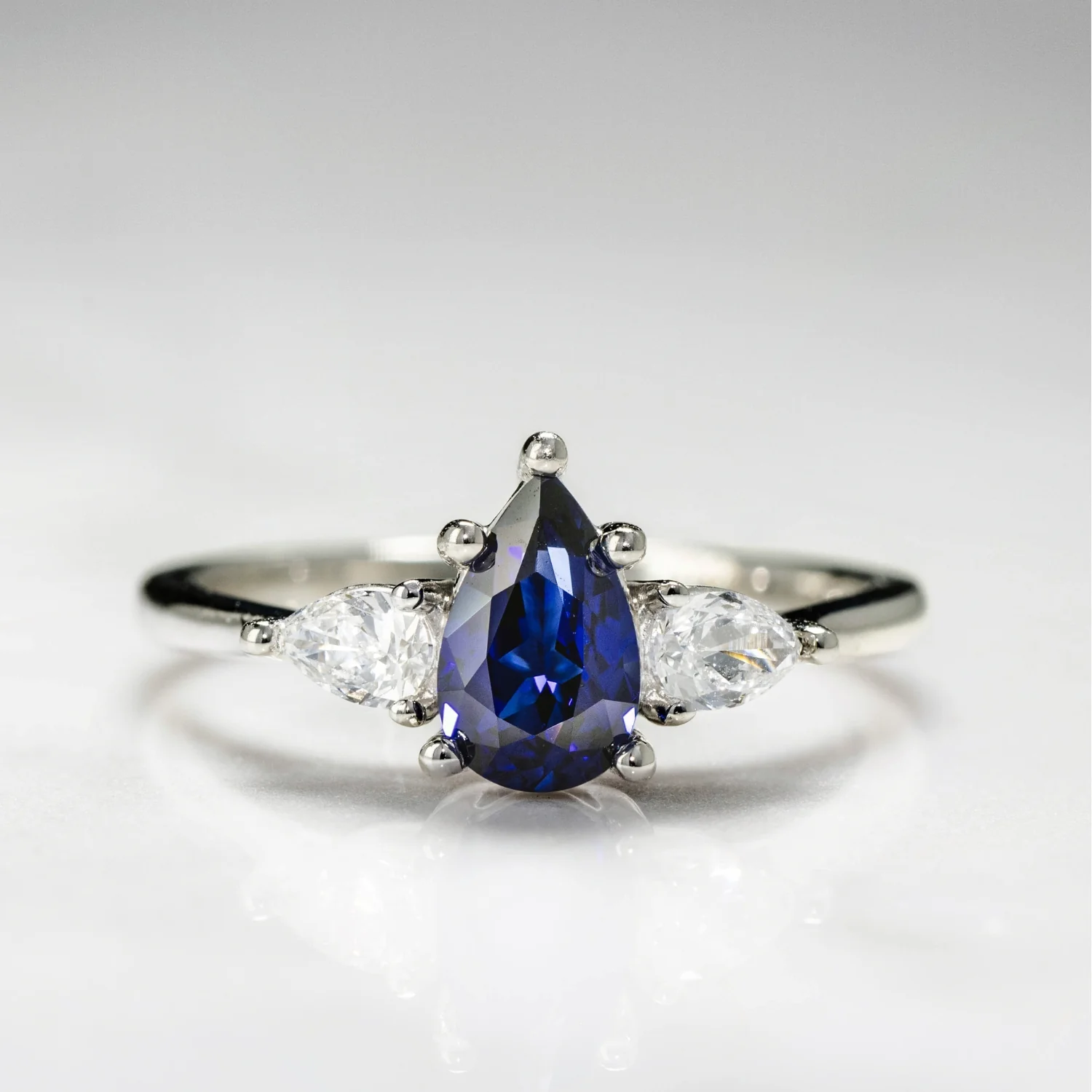 The Diana - Blue Sapphire Pear Cut Three Stone Engagement Ring with Diamond Accents - Image 14