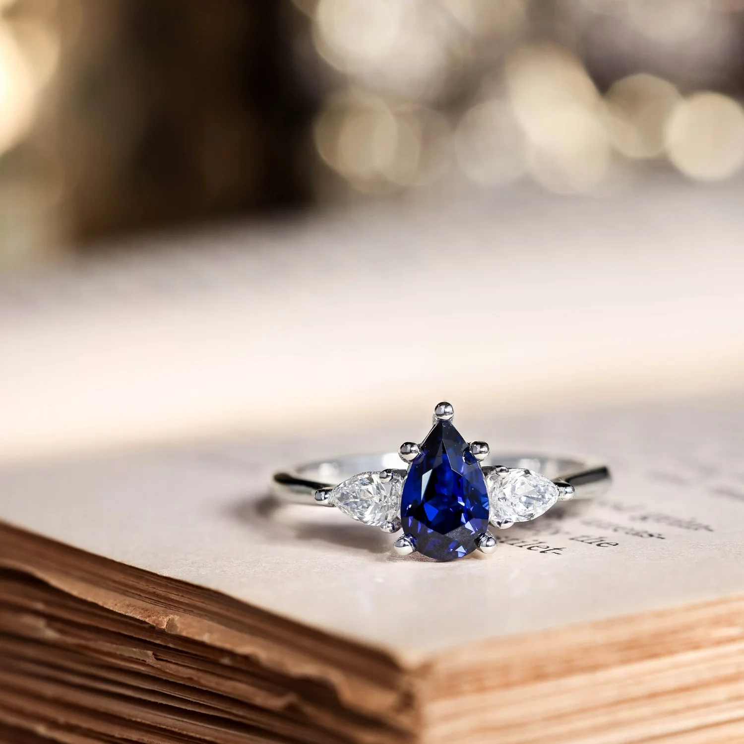 The Diana - Blue Sapphire Pear Cut Three Stone Engagement Ring with Diamond Accents - Image 4