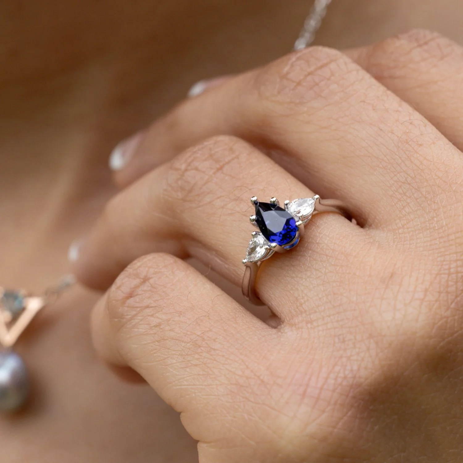 The Diana - Blue Sapphire Pear Cut Three Stone Engagement Ring with Diamond Accents - Image 7