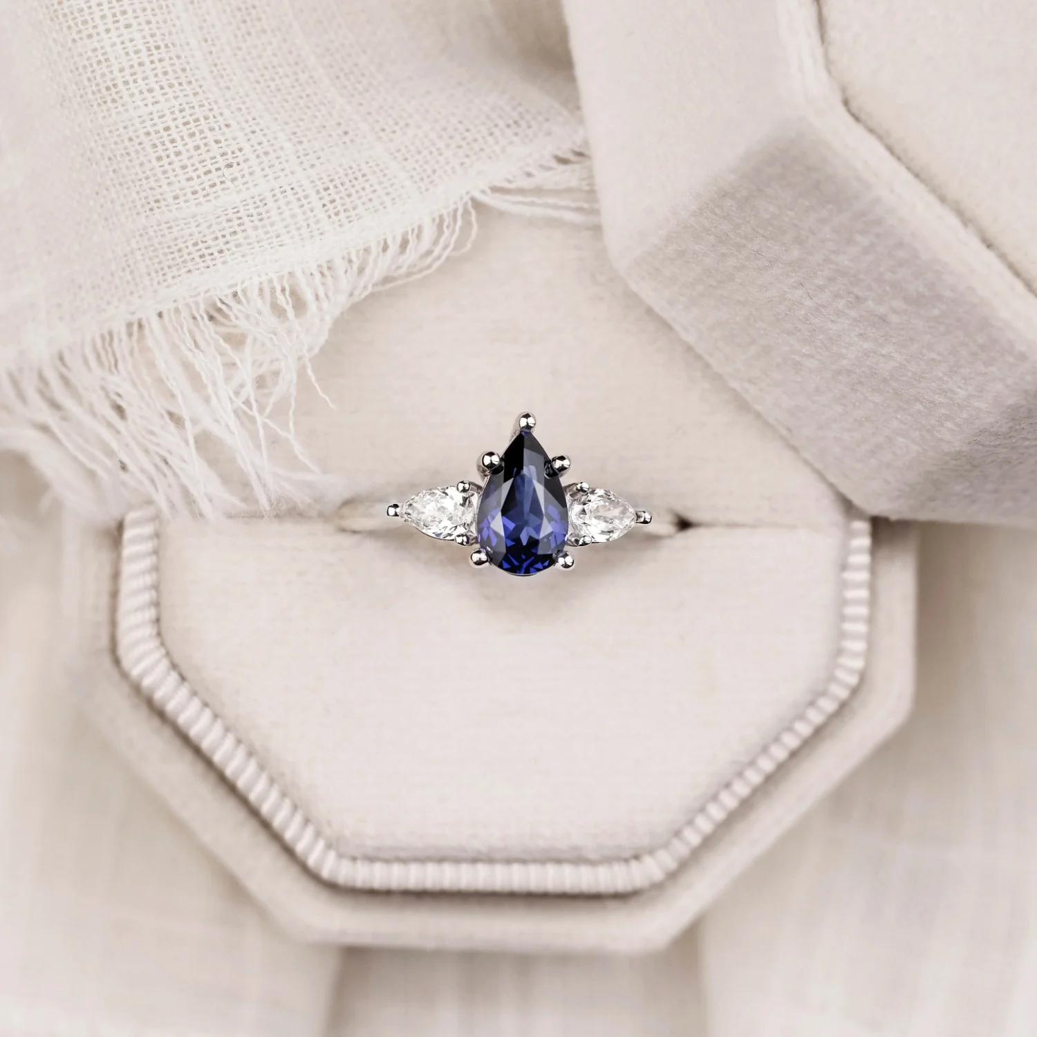 The Diana - Blue Sapphire Pear Cut Three Stone Engagement Ring with Diamond Accents - Image 9