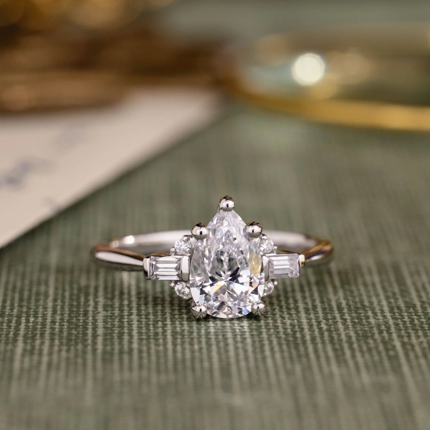 The Juno - Pear-Shaped Diamond Engagement Ring with Straight Baguette and Round Diamond Accents - Image 10