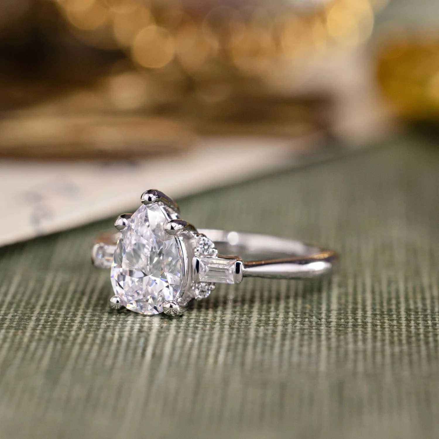 The Juno - Pear-Shaped Diamond Engagement Ring with Straight Baguette and Round Diamond Accents - Image 13