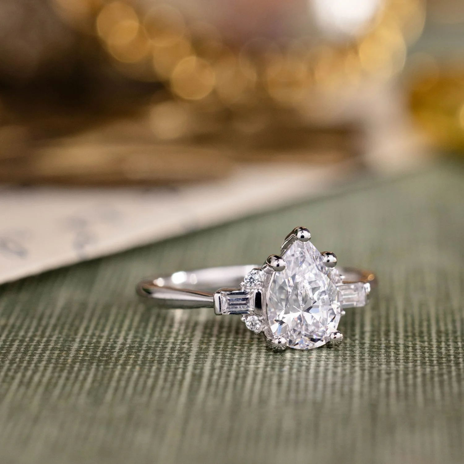 The Juno - Pear-Shaped Diamond Engagement Ring with Straight Baguette and Round Diamond Accents - Image 3