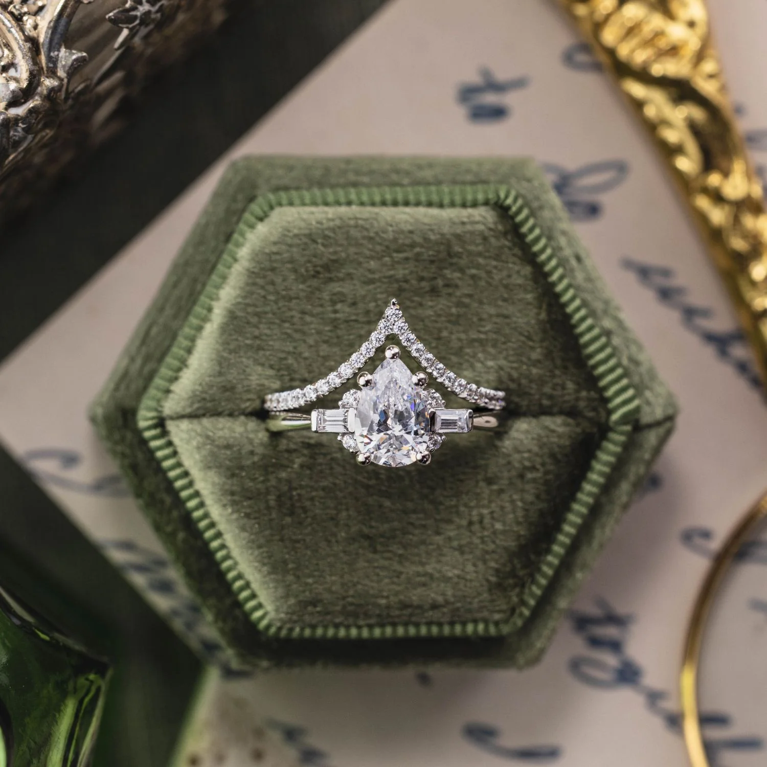 The Juno - Pear-Shaped Diamond Engagement Ring with Straight Baguette and Round Diamond Accents - Image 5