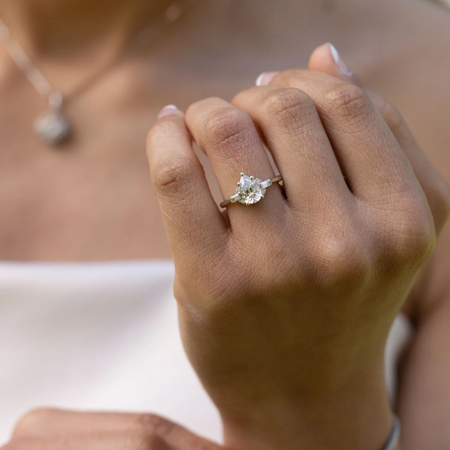 The Juno - Pear-Shaped Diamond Engagement Ring with Straight Baguette and Round Diamond Accents - Image 6