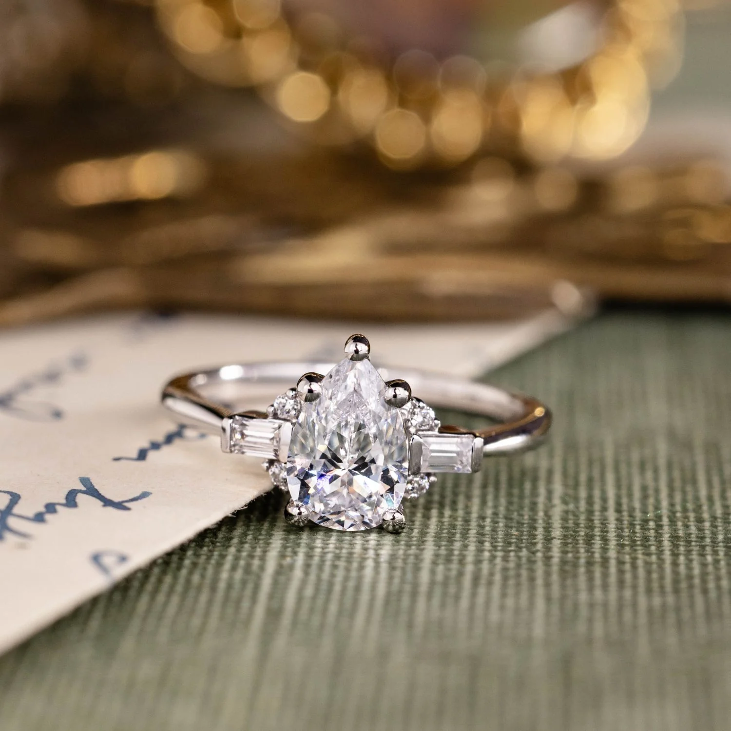 The Juno - Pear-Shaped Diamond Engagement Ring with Straight Baguette and Round Diamond Accents - Image 7
