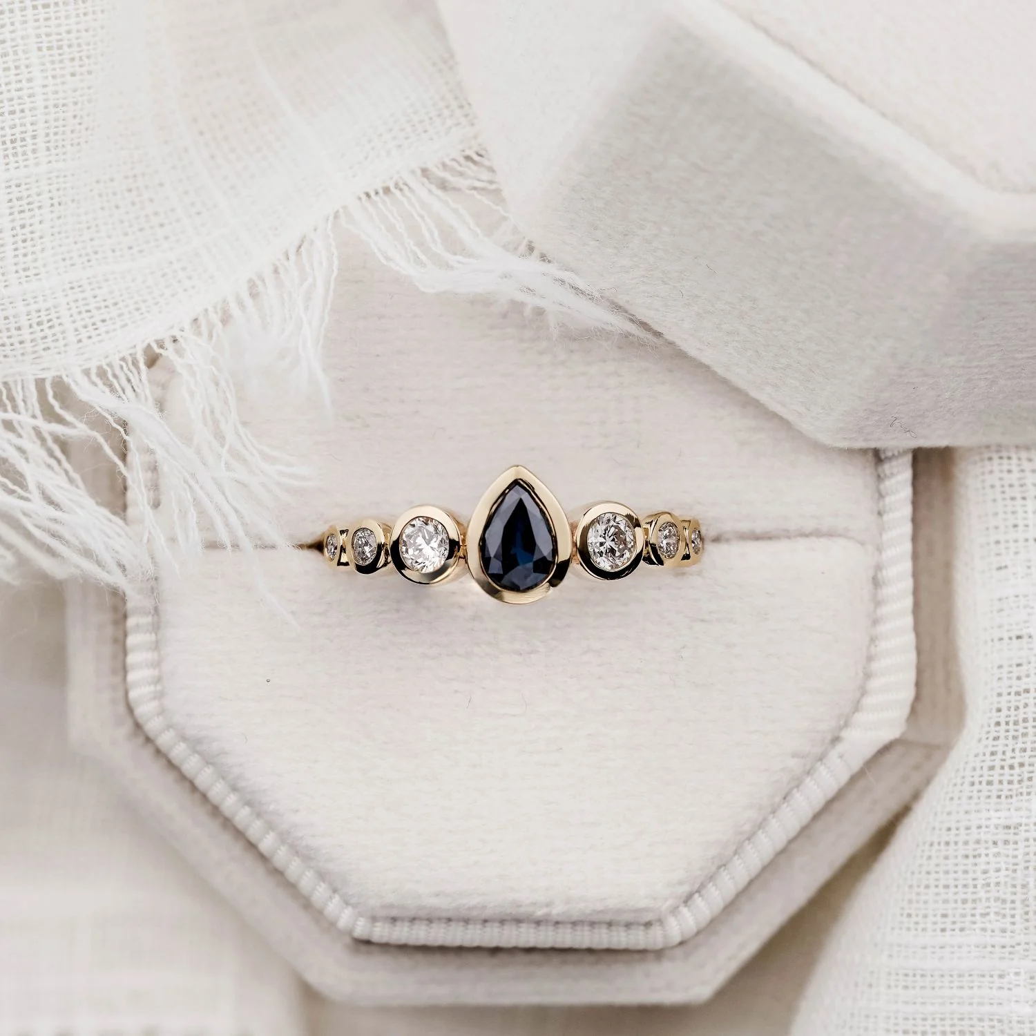 The Lyra - Bezel Set Pear Cut Blue Sapphire Engagement Ring with Diamond Accents - Image 11