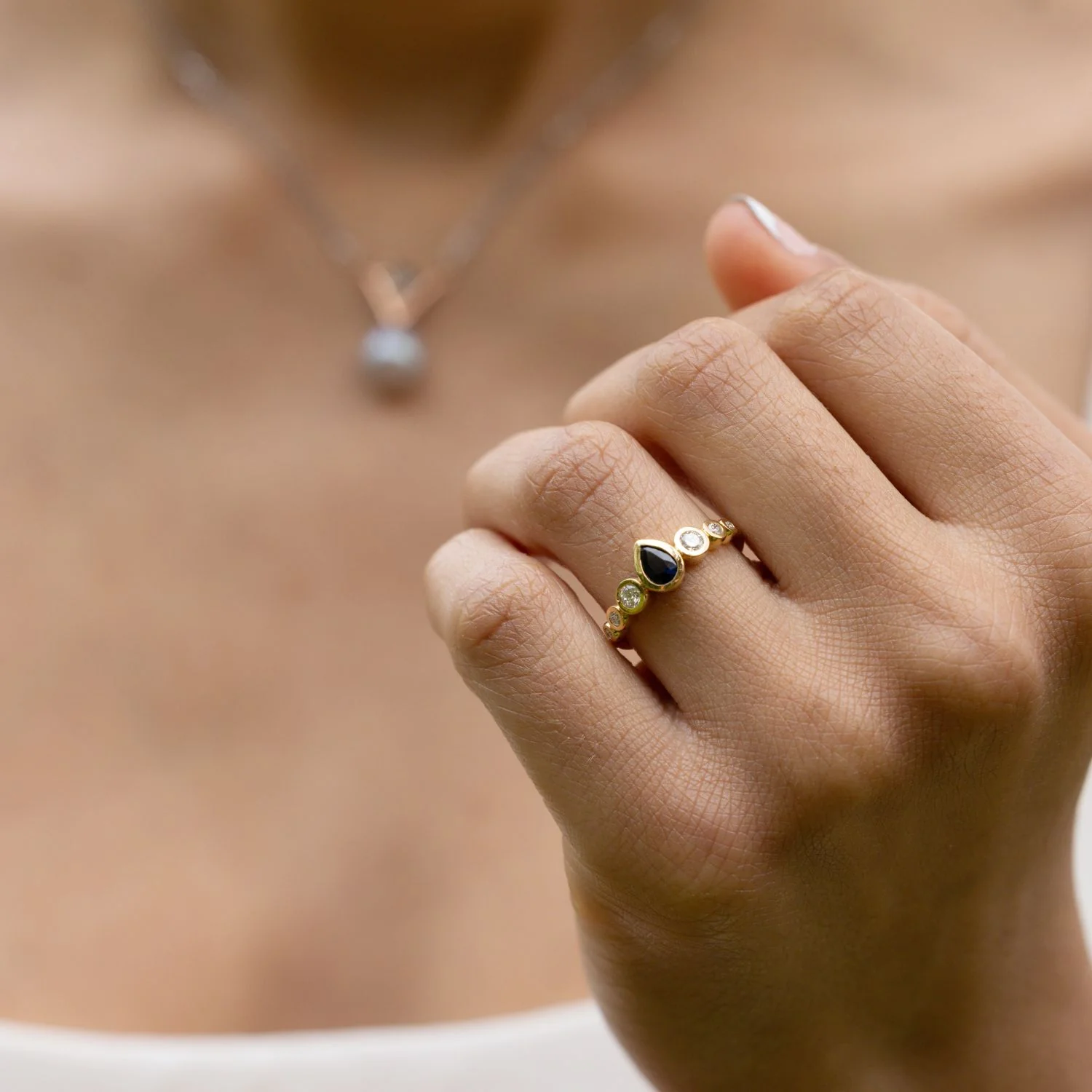 The Lyra - Bezel Set Pear Cut Blue Sapphire Engagement Ring with Diamond Accents - Image 4