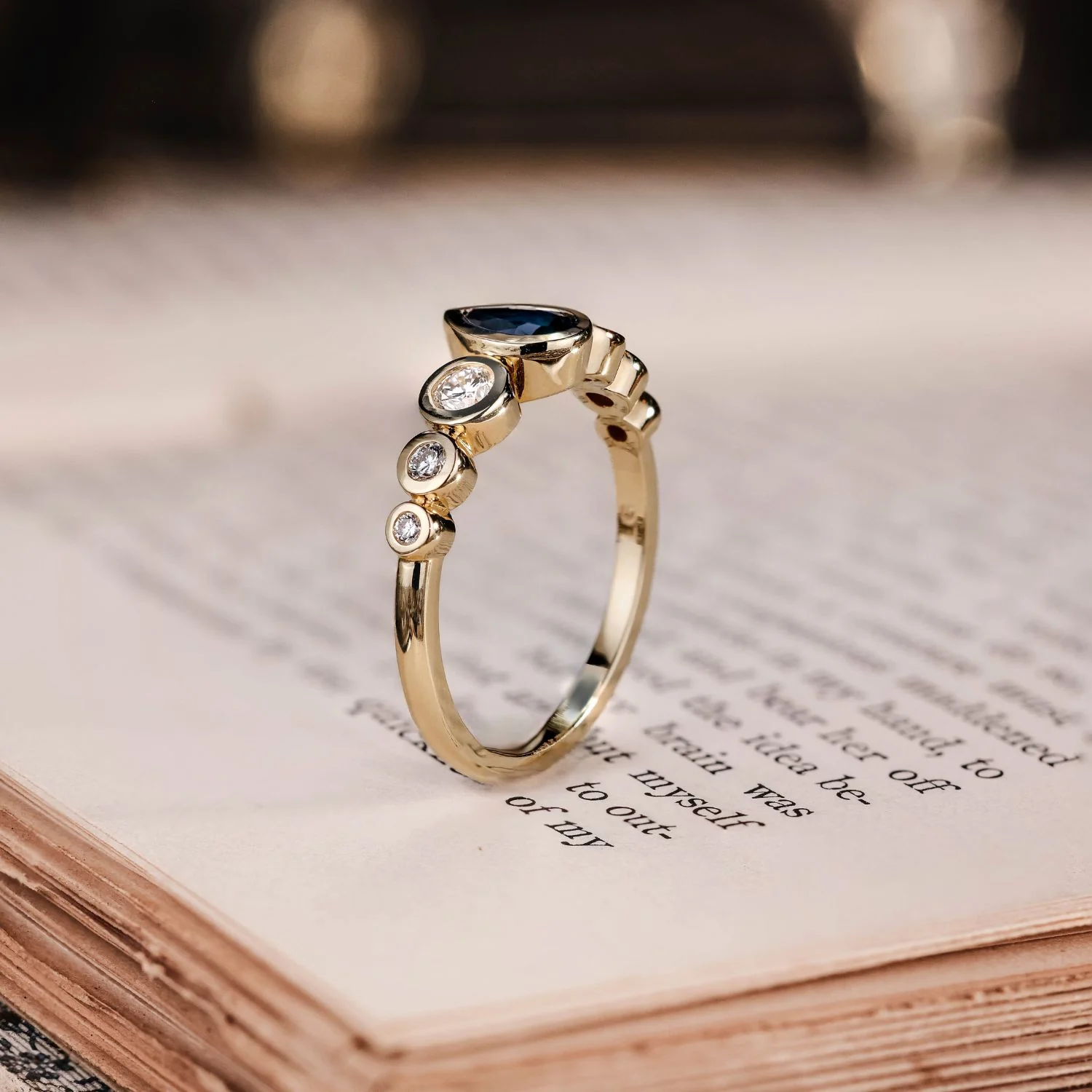 The Lyra - Bezel Set Pear Cut Blue Sapphire Engagement Ring with Diamond Accents - Image 5