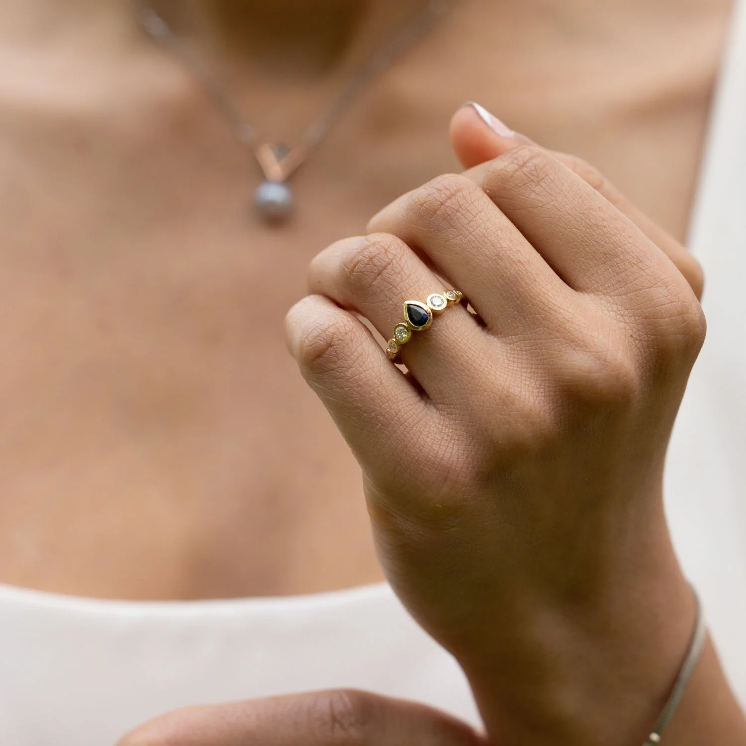 The Lyra - Bezel Set Pear Cut Blue Sapphire Engagement Ring with Diamond Accents - Image 8